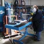 Welder demonstrating proper ergonomics when welding