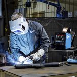 Welder welding with a semi-automatic MIG gun