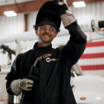 Welder holding btb MIG gun